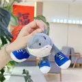 Creative shark plush pendant featuring gray fur and tiny blue sneakers as unique details - Three-legged Running Shoe Shark (Gold Clasp)
