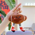 Close-up of American football plush keychain with cute face and sporty shoes detail - Football Style (Gold Buckle)
