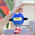 Detail of creative plush badminton keychain with blue fur and smiley face dangling from hand - Volleyball Style (Gold Buckle)