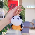 Nahaufnahme eines Panda-Plüsch-Schlüsselanhängers in Weiß Schwarz und Orange mit Goldring - Wende-Panda Goldene Schnalle