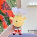 Gros plan d'un porte-clés en peluche jaune portant des baskets et une fleur - Badminton (Chaîne)
