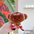 Détail d'un porte-clés en peluche football américain avec visage souriant et baskets - Rugby (Chaîne)