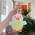 Close-up of a cute green and white plush chick keychain with orange feet and metal ring - Simple Chick with Green Belly