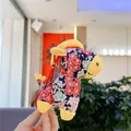 Dettaglio di peluche a forma di cavallo in tessuto floreale blu con motivi di prugna - Stile Cinese Fiore di Prugno Blu Scuro