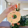 Close-up of cute plush donut keychain with embroidered sugar needle and smiley face - Pink Mouth Expression / Plain Chain