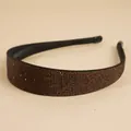 Close-up of sparkling brown rhinestones on a wide-brimmed non-slip fashion headband - Coffee