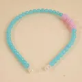 Blue beaded headband with pink textured spheres and white teardrop end caps - Blue