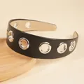 Wide black faux leather headband featuring silver metal grommets and anti-slip lining - Black