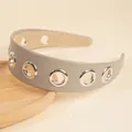 Minimalist grey PU leather headband featuring five polished silver metal eyelets - Gray