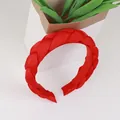 Braided headband in vibrant red organza fabric with a classic three-strand twist design - Red