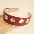 Wide burgundy faux leather headband featuring silver metal grommets and non-slip lining - Burgundy