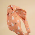 Orange Halloween headband featuring ghost and skull patterns with a knotted design - Orange Skeleton