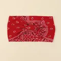Detail of red paisley wide headband with bohemian knot design and elastic fabric - Red
