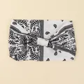 White paisley bohemian wide headband with black knot detail for women’s fitness styling - White