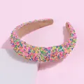Detail of candy-colored sponge headband with vibrant sprinkle-like colorful decorations - Pink