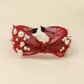Red tulle knotted headband decorated with white faux pearls and a central twist design - Burgundy