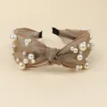 Elegant knotted champagne silk headband featuring irregular white faux pearls - Khaki
