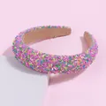Close-up of candy-colored beaded sponge headband with textured sprinkles decoration - Purple