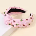 Elegante cerchietto rosa annodato con perle e strass colorati su base in tessuto - Rosa