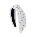 Close-up of white knotted headband featuring 3D flowers, pearls, and rhinestones - White