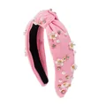 Detail of pink knotted headband featuring white flowers, pearls and colorful rhinestones - Pink