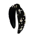 Detail of black knotted headband featuring camellia flowers, pearls and rhinestones - Black