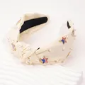 Detail of cream knotted headband with faux pearls and US flag star charms - White Star