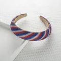 Padded sponge headband featuring red, white, and blue rhinestone diagonal stripes - Stripe Style