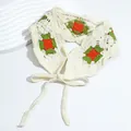 Detail of crochet floral headscarf with granny square pattern and beige ties - Checkered Green Orange