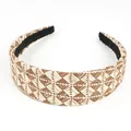 Macro view of woven raffia headband showing beige checkered pattern and non-slip lining - Khaki