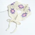 Close-up of handmade crochet headband with purple and pink floral knit patterns - Checkered Purple Pink