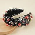 Detail of knotted Halloween headband with silver spider web print and red pearls - Spider Web (Black) / Black