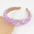 Detail of beaded padded headband with colorful sequins and soft velvet lining texture - Pink