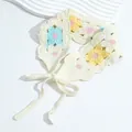 Detailed knit texture of handmade floral crochet headband with adjustable ties - Blue Yellow Flower