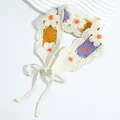 Detailed view of handmade crochet floral headband with purple and yellow knit patterns - Floral Yellow Purple