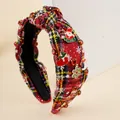Detail of red tweed Christmas headband featuring Santa charms and sparkling rhinestones - Red/Black Plaid