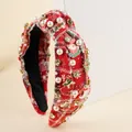 Close-up of red plaid tweed headband with pearls, rhinestones and Xmas charms - Red And White Plaid Santa