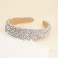 Close-up of wide headband featuring shimmering silver rhinestones and white pearls detail - Silver