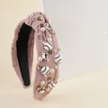 Pink knotted headband featuring baseball motifs with white pearls and sparkling rhinestones - Pink