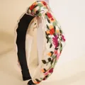 Ethno-Knotenstirnband mit bunten Blumenstickereien auf cremefarbenem Stoff - Weiß