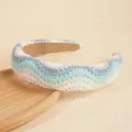 Handmade crochet wide headband with blue wave pattern on a wooden tray - Light Blue