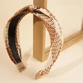 Bohemian raffia braided headband with tortoiseshell ring accent in brown and cream colors - Brown