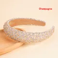 Macro shot of champagne sponge headband with sparkling rhinestones and crystal gems - Champagne