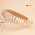 Detail of the golden thick sponge headband with four rows of square rhinestones on a shiny base - Gold