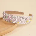 Pink wide headband with colorful stars, pearls, and rhinestones on a wooden tray - Star Pink
