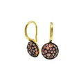 Macro view of gold French hook earrings with pave-set pink and black gemstones - Gold + Champagne