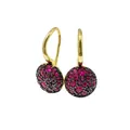 Macro detail of gold-plated drop earrings with pavé set red gems and black crystals - Gold+Magenta