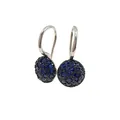 Macro shot of silver drop earrings with pavé set dark blue and black gemstones - Silver + Blue