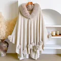 Beige knitted poncho cape with faux rabbit fur collar and soft pompom details - 152x102cm / Apricot