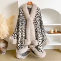 Detail of leopard print shawl with beige faux fur collar hanging on a wooden hanger - One Size / Beige
